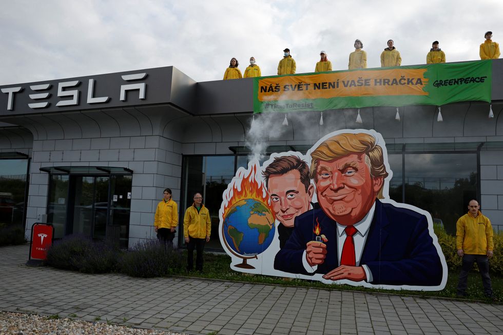 Greenpeace activists protest against Elon Musk and the US President Trump in Prague