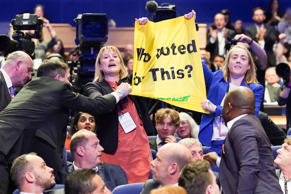 Greenpeace protesters interrupt Prime Minister Liz Truss as she delivers her keynote speech to the Conservative Party annual conference at the International Convention Centre in Birmingham. Picture date: Wednesday October 5, 2022.