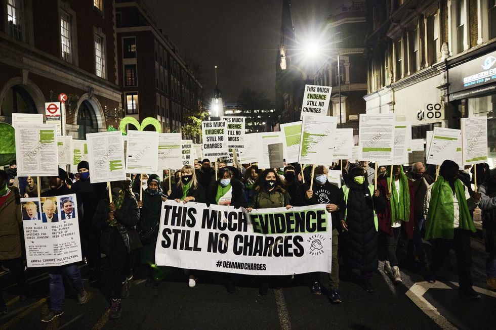 Grenfell United handout image dated 14/12/21 of a silent walk organised by campaign group Grenfell United, which was held for the first time in 18 months this evening, as those affected joined together near the site to remember the 72 lives lost and countless others caught up in the events of June 14 2017. Issue date: Tuesday December 14, 2021.