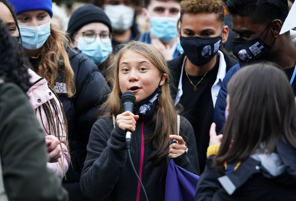 Greta Thunberg alongside fellow climate activists during a demonstration at Festival Park, Glasgow, on the first day of the Cop26 summit.