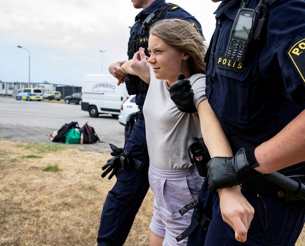 Greta Thunberg as they move climate activists who are blocking the entrance to Oljehamnen in Malmo