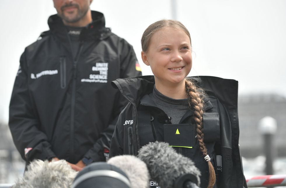 Greta Thunberg entering a boat for a voyage from the US to Plymouth