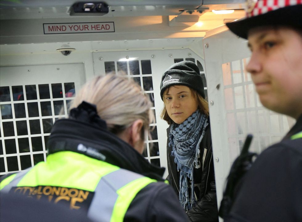 Greta Thunberg in a City of London Police van