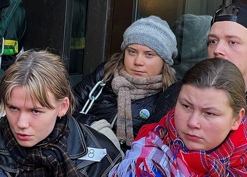Greta Thunberg protesting outside government building