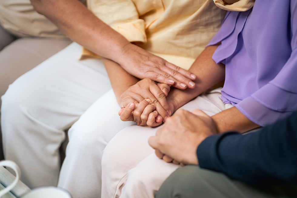 Group of friends consoling each other