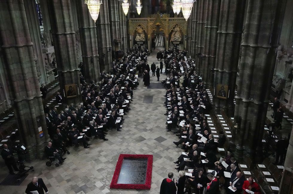 Guests and officials begin to take their places at the State Funeral of Queen Elizabeth II, held at Westminster Abbey, London. Picture date: Monday September 19, 2022.