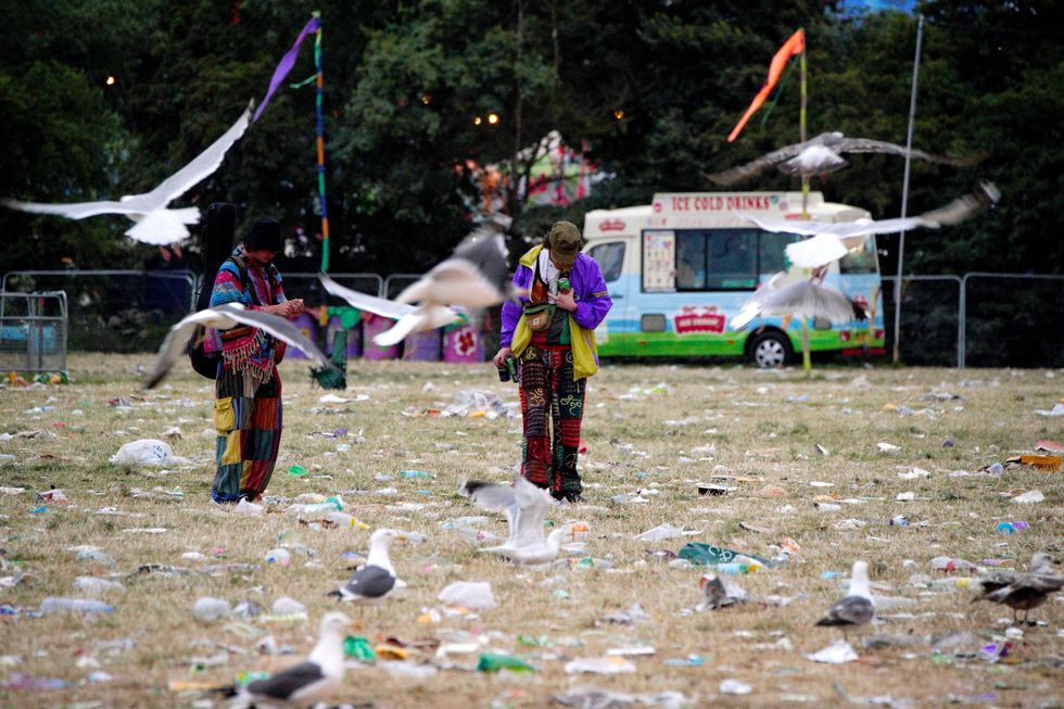 Gulls fly over waste left at Worthy Farm in Somerset as festival goers leave following the Glastonbury Festival. Picture date: Monday June 27, 2022.