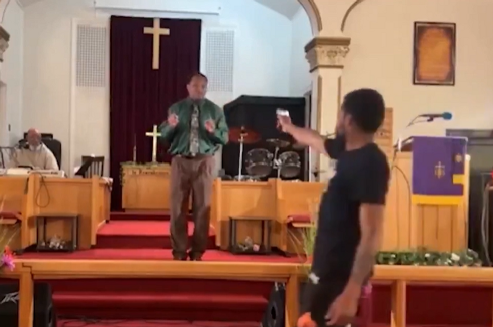 Gunman threatens pastor