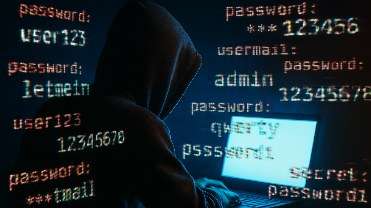 hacker sitting at a laptop