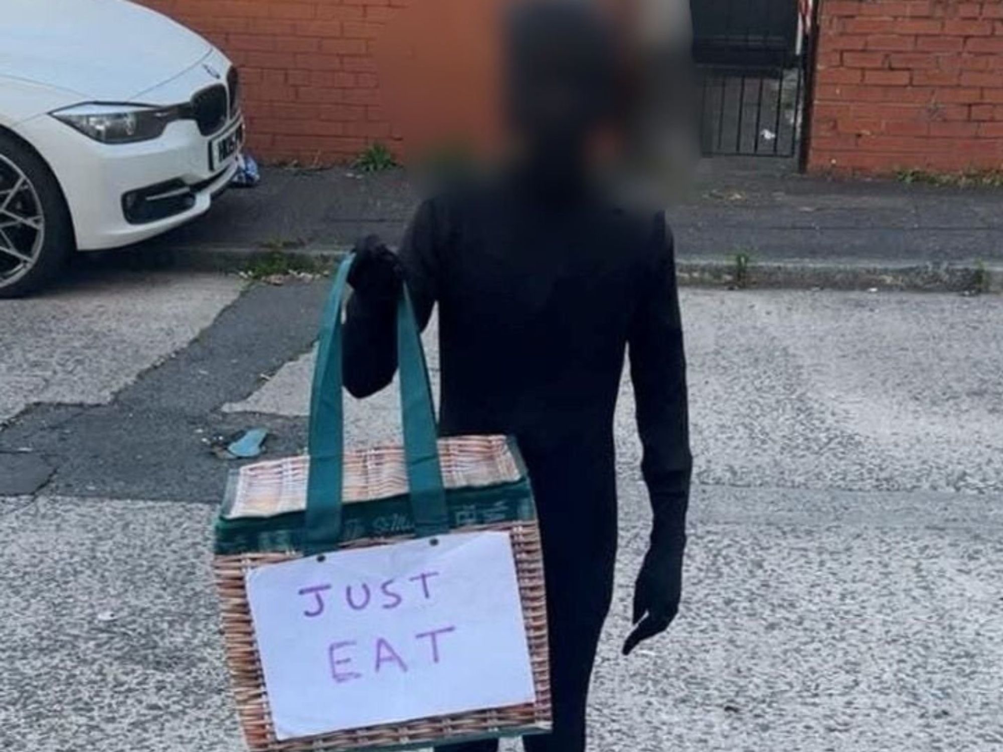 Halloween racism row erupts after British schoolboy dressed up as Just Eat delivery driver in bla...