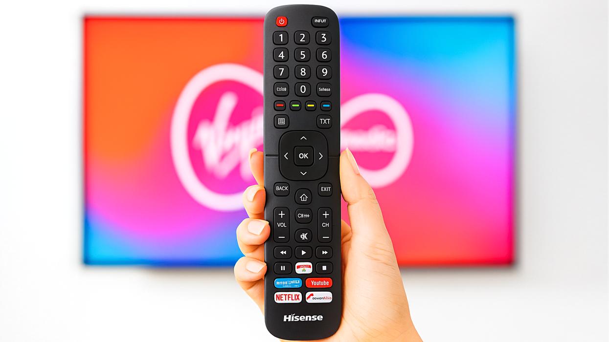hand holding a hisense tv remote control with virgin media tv in the background