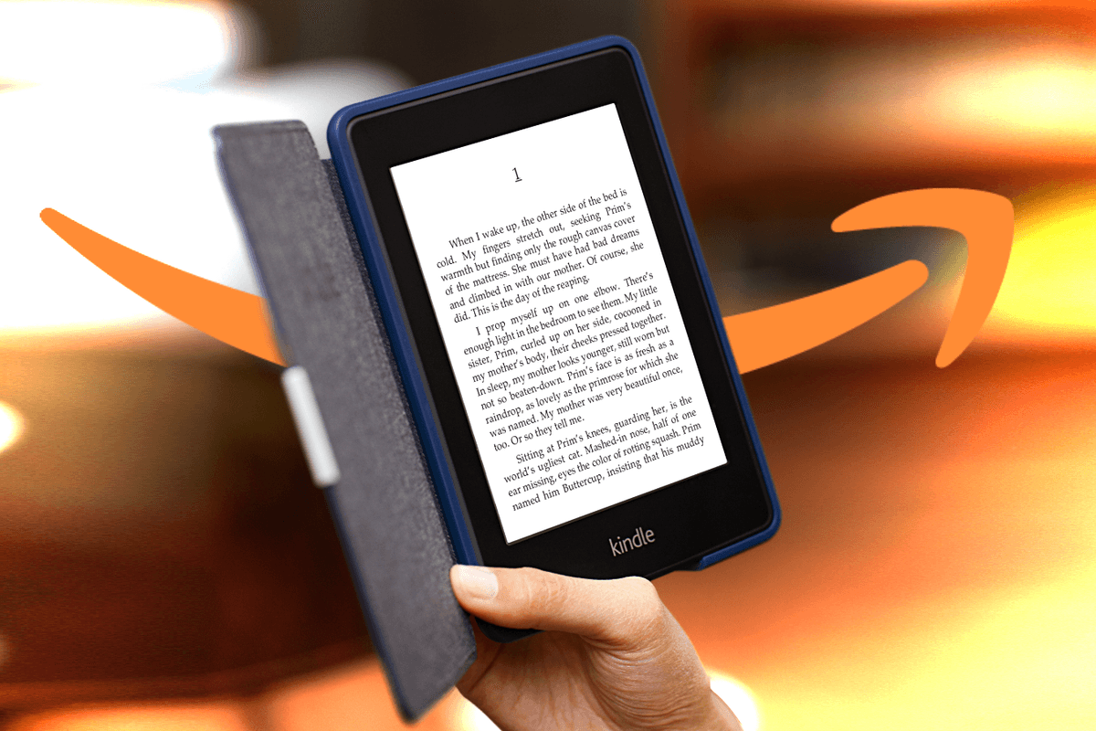 hand holding a Kindle e-readers with a dramatic colourful background