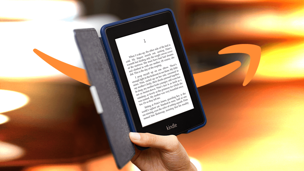 hand holding a Kindle e-readers with a dramatic colourful background