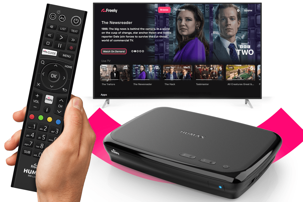 hand holding a remote control with the humax Aura EZ 4K TV Recorder with Freely pictured in the background