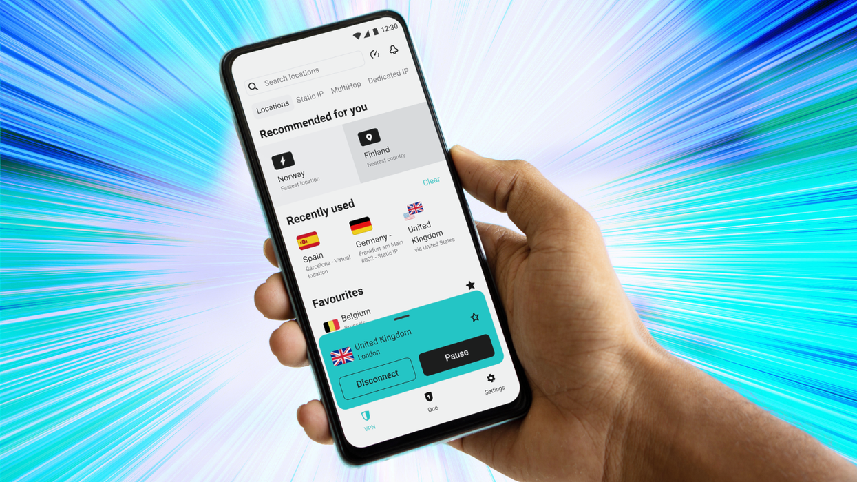 hand holding a smartphone with a surfshark vpn