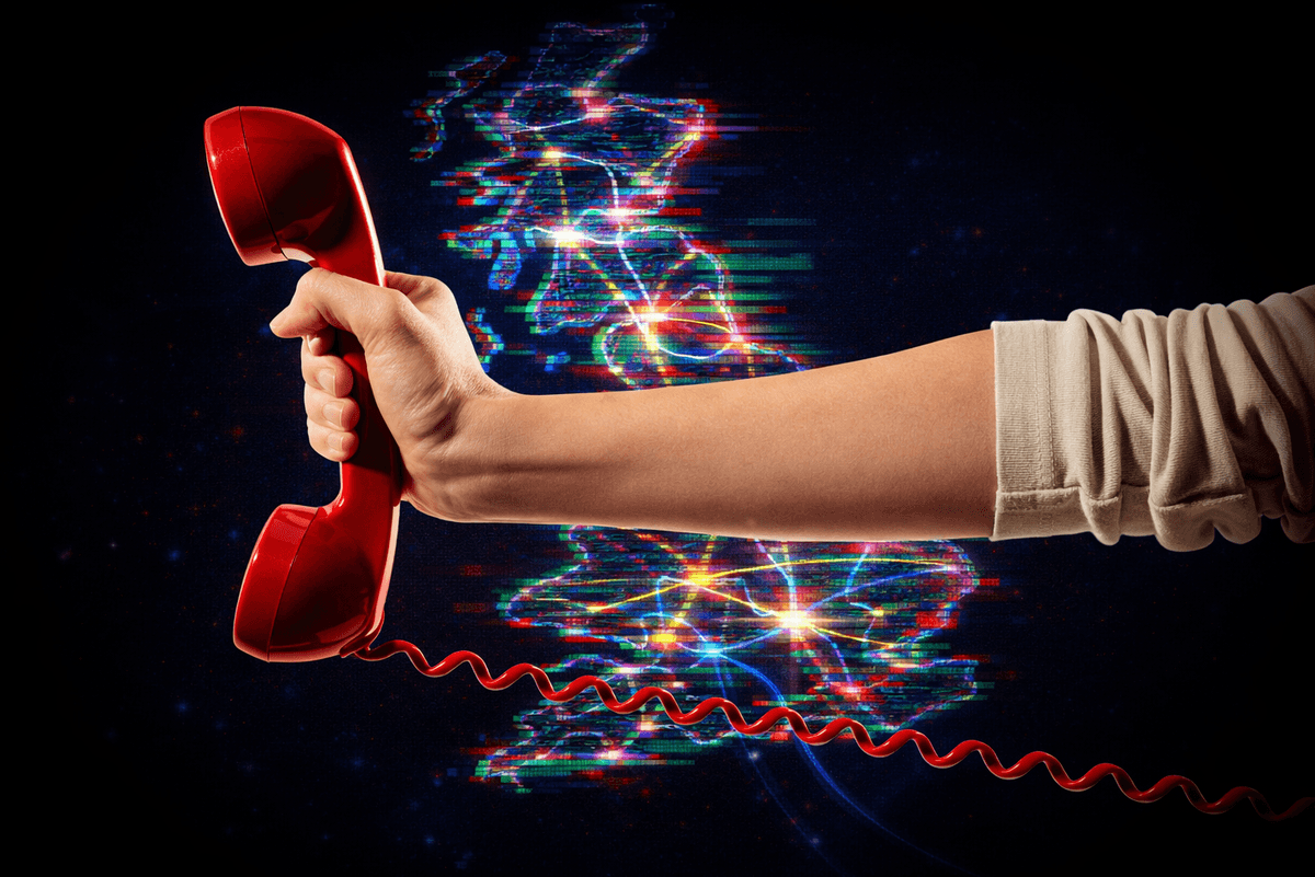 hand holding a traditional landline phone in red with a map of the UK with broadband connections in the background.
