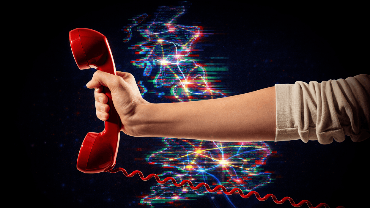hand holding a traditional landline phone in red with a map of the UK with broadband connections in the background.