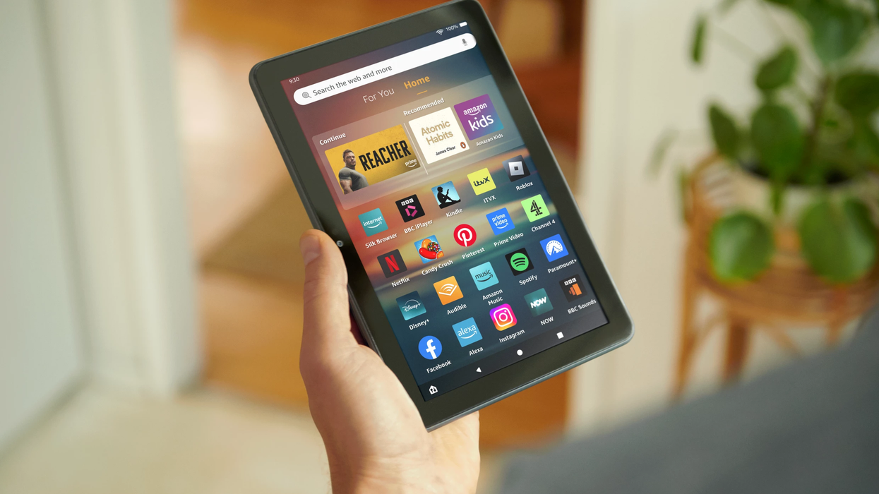 Hand holding Amazon Fire HD 8 tablet