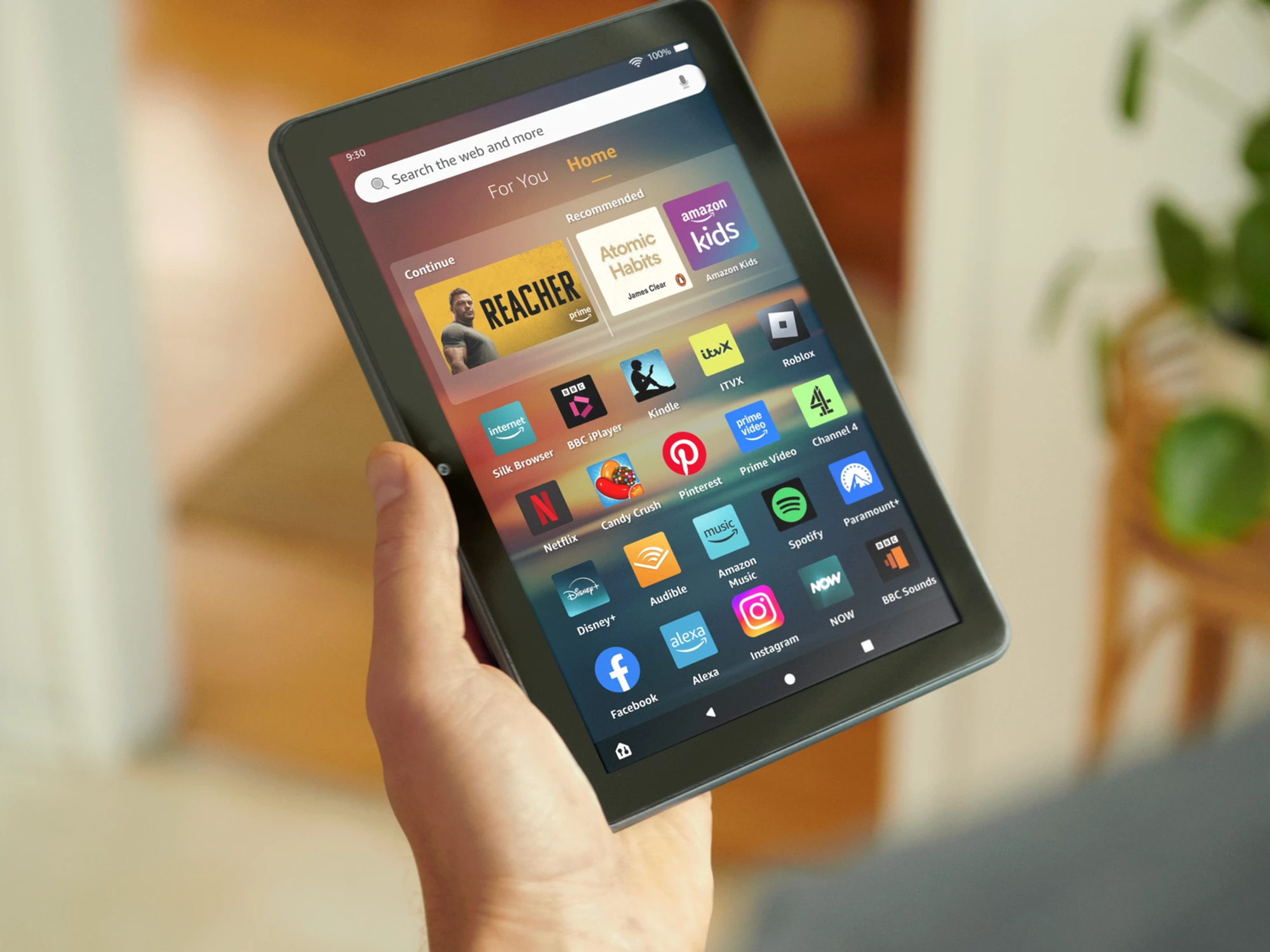 Hand holding Amazon Fire HD 8 tablet