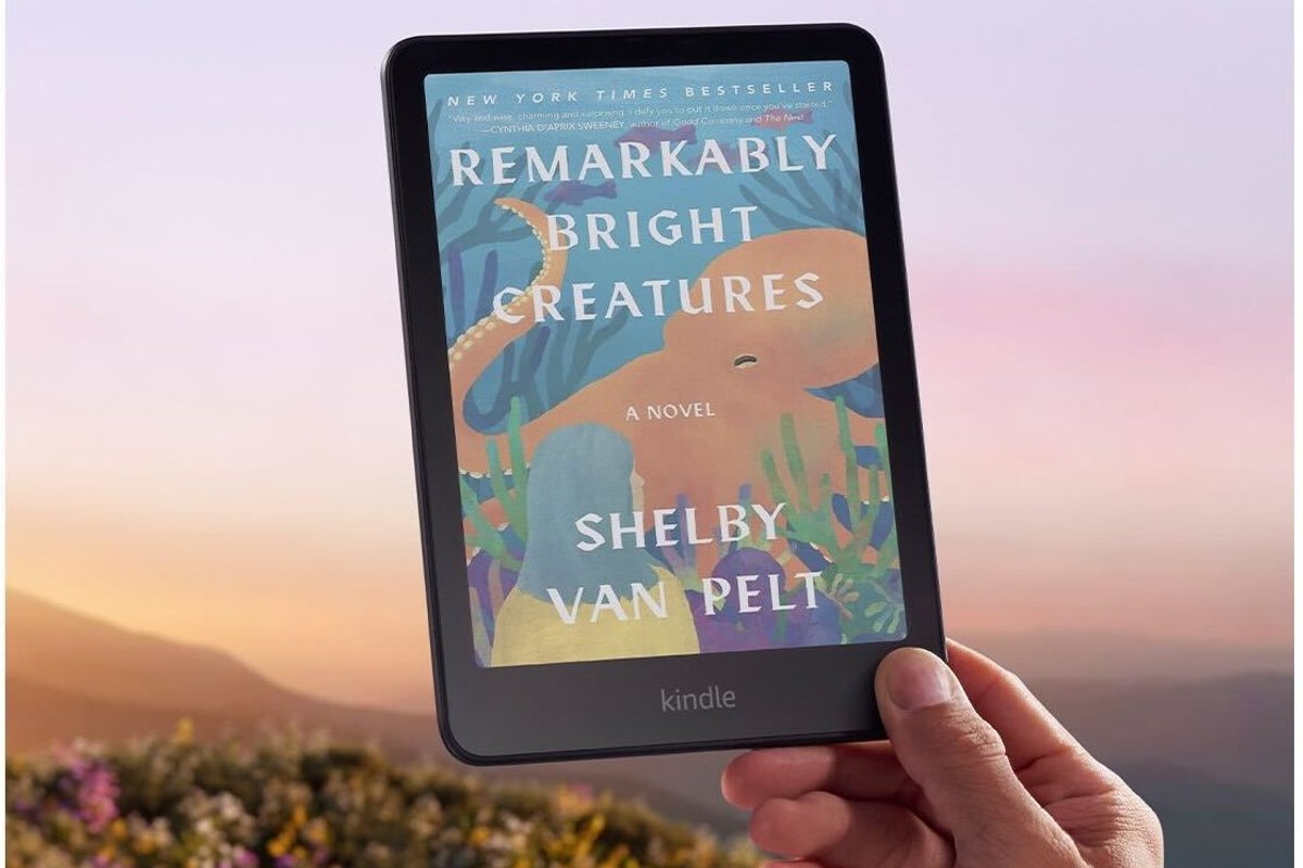 Hand holding Amazon Kindle