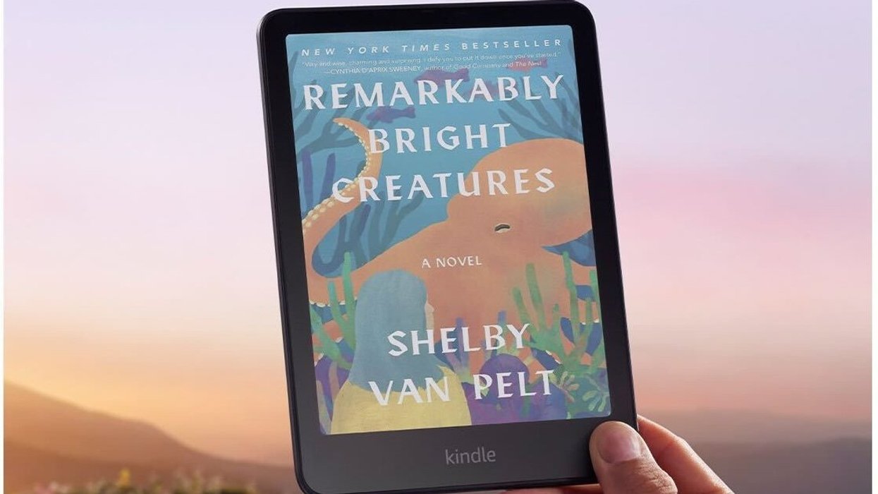 Hand holding Amazon Kindle