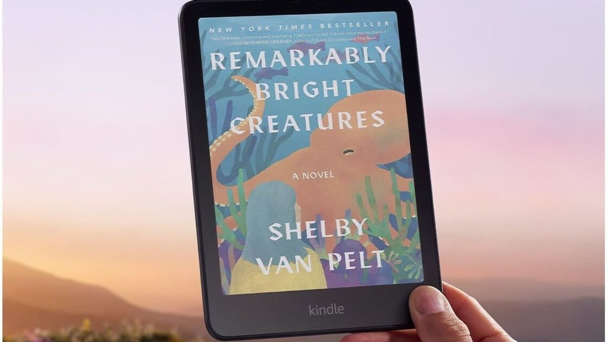 Hand holding Amazon Kindle