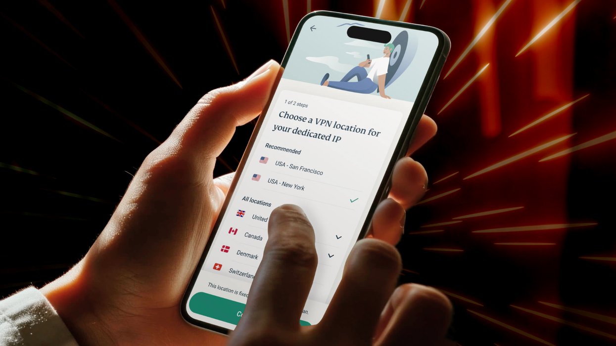 hand holding an iPhone running ExpressVPN with zoom lines showing movement in the background