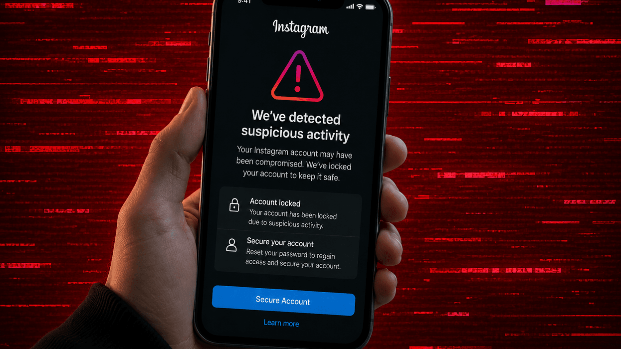Hand holding mobile with Instagram suspicious activity warning
