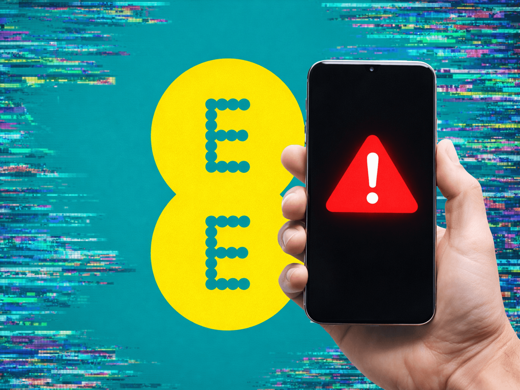 Hand holding mobile with warning symbol in front of EE logo