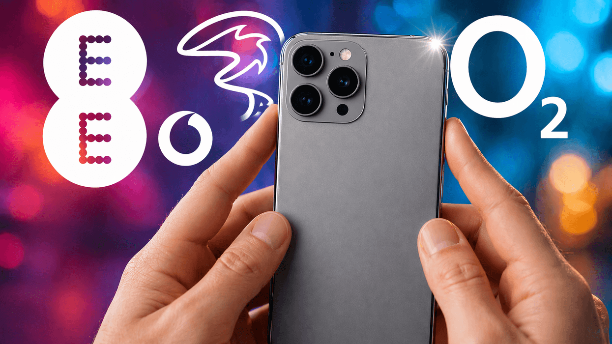 Hand holding phone with mobile providers' logos in the background