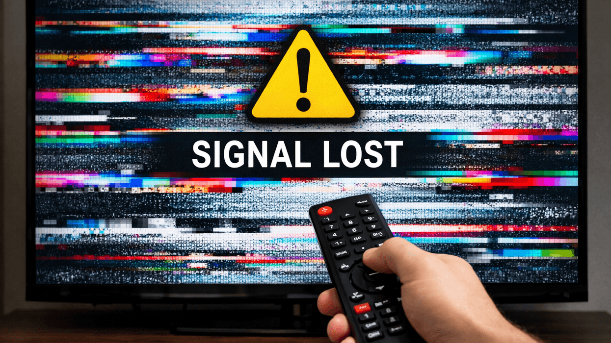 Hand holding remote in front of TV with a signal lost symbol