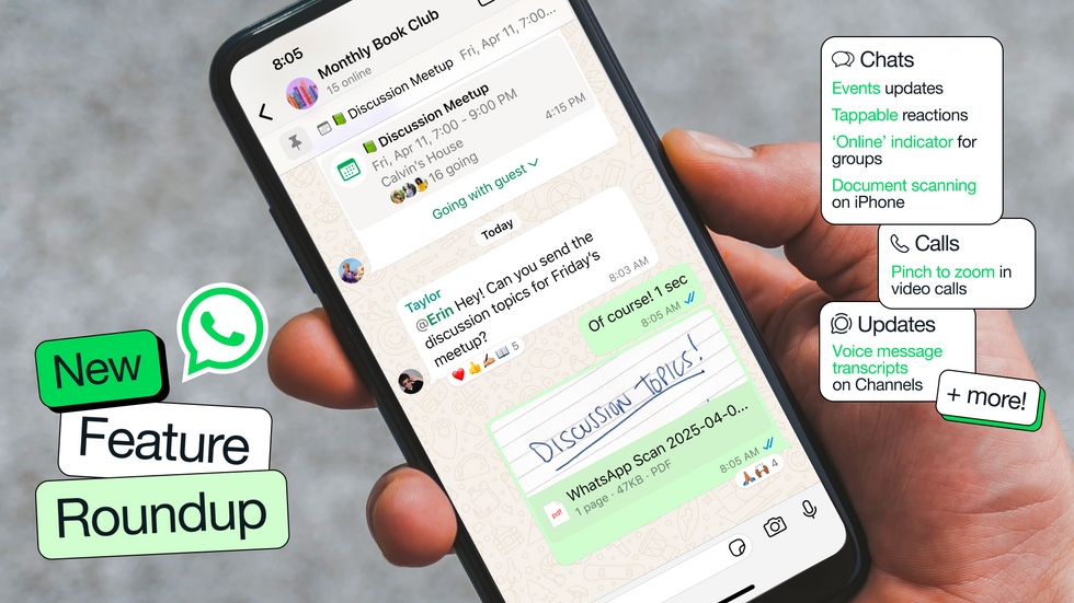hand holding smartphone with whatsapp running