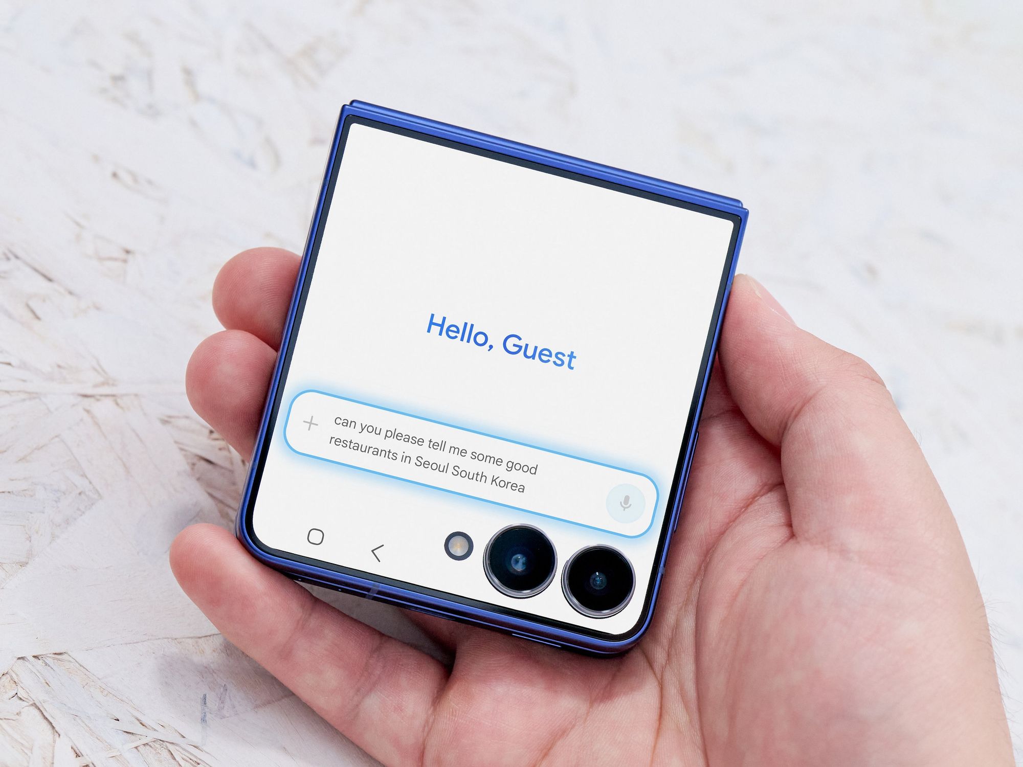 hand holding the galaxy z Flip 7 and using the new Galaxy AI chat interface