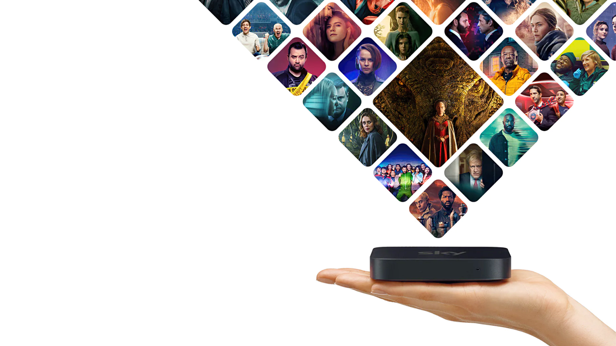 hand holding the sky stream box with previews of the biggest shows hovering overhead