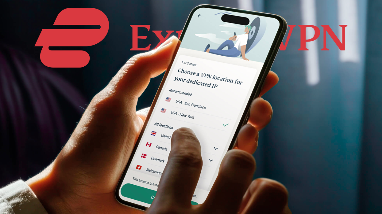hand holds a smartphone with the expressvpn app