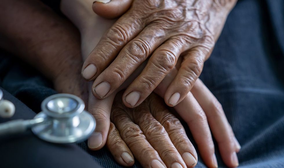 Hand on top of another hand