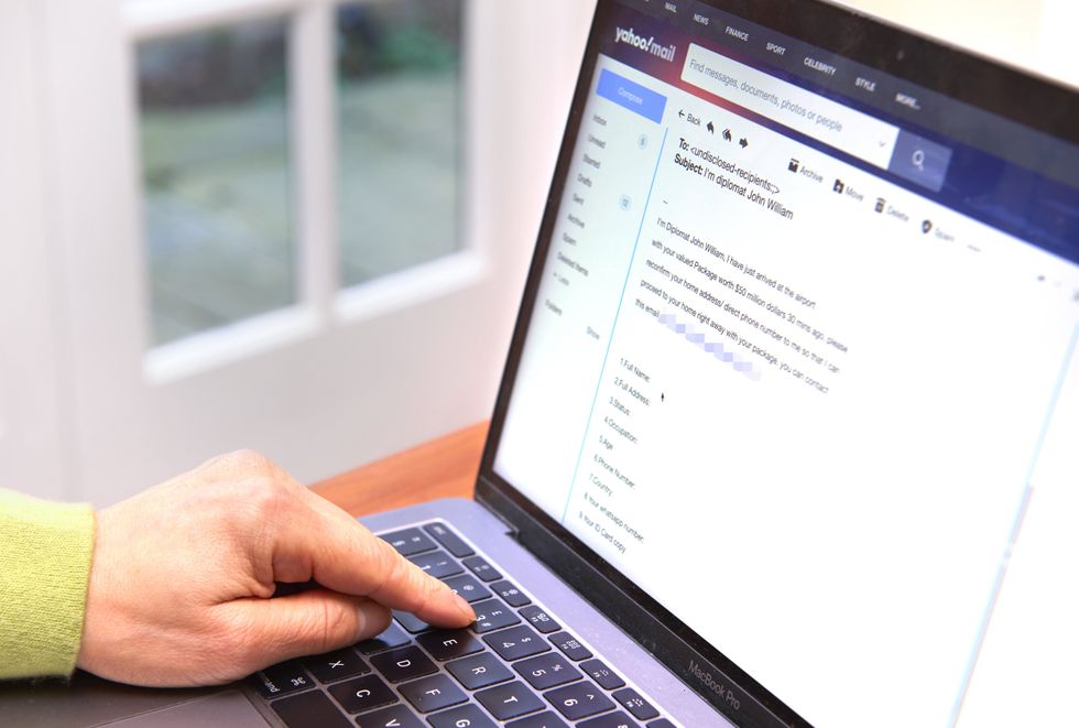 hand over keyboard on laptop