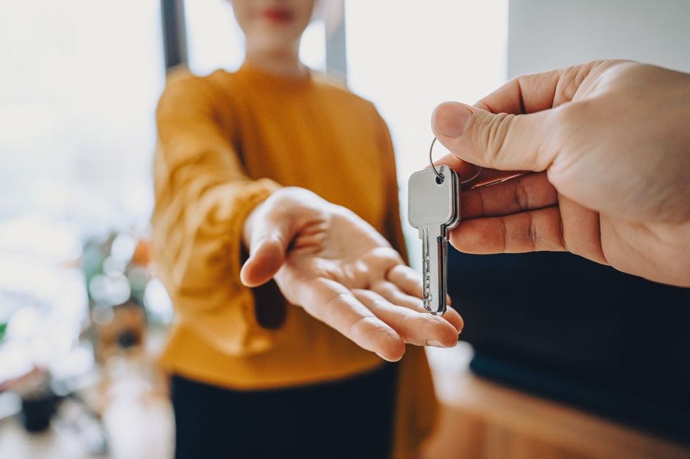 hand reaching out for keys