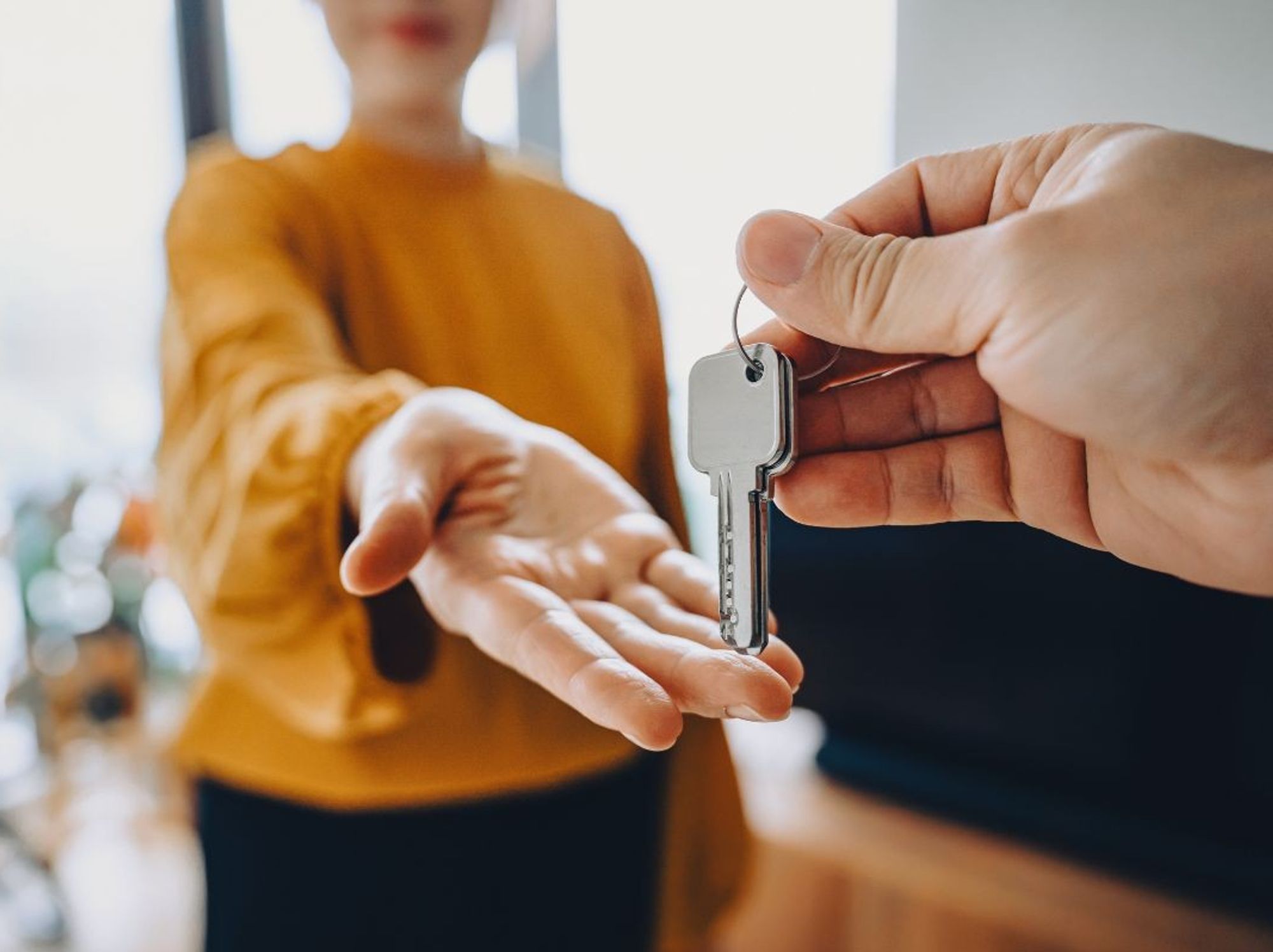 hand reaching out for keys