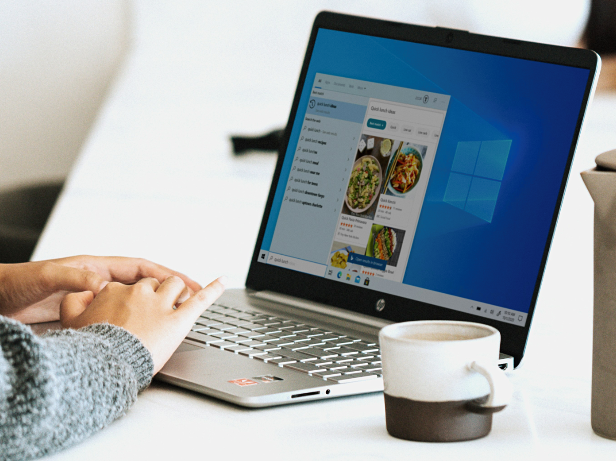 hand using a windows 10 laptop