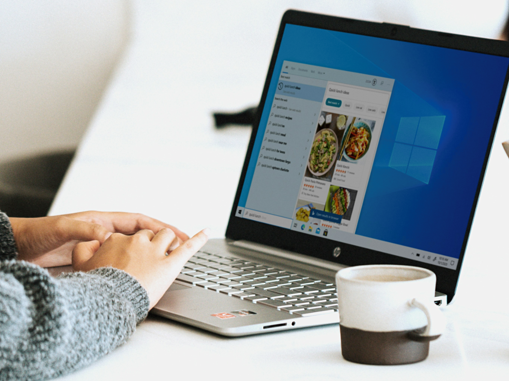 hand using a windows 10 laptop