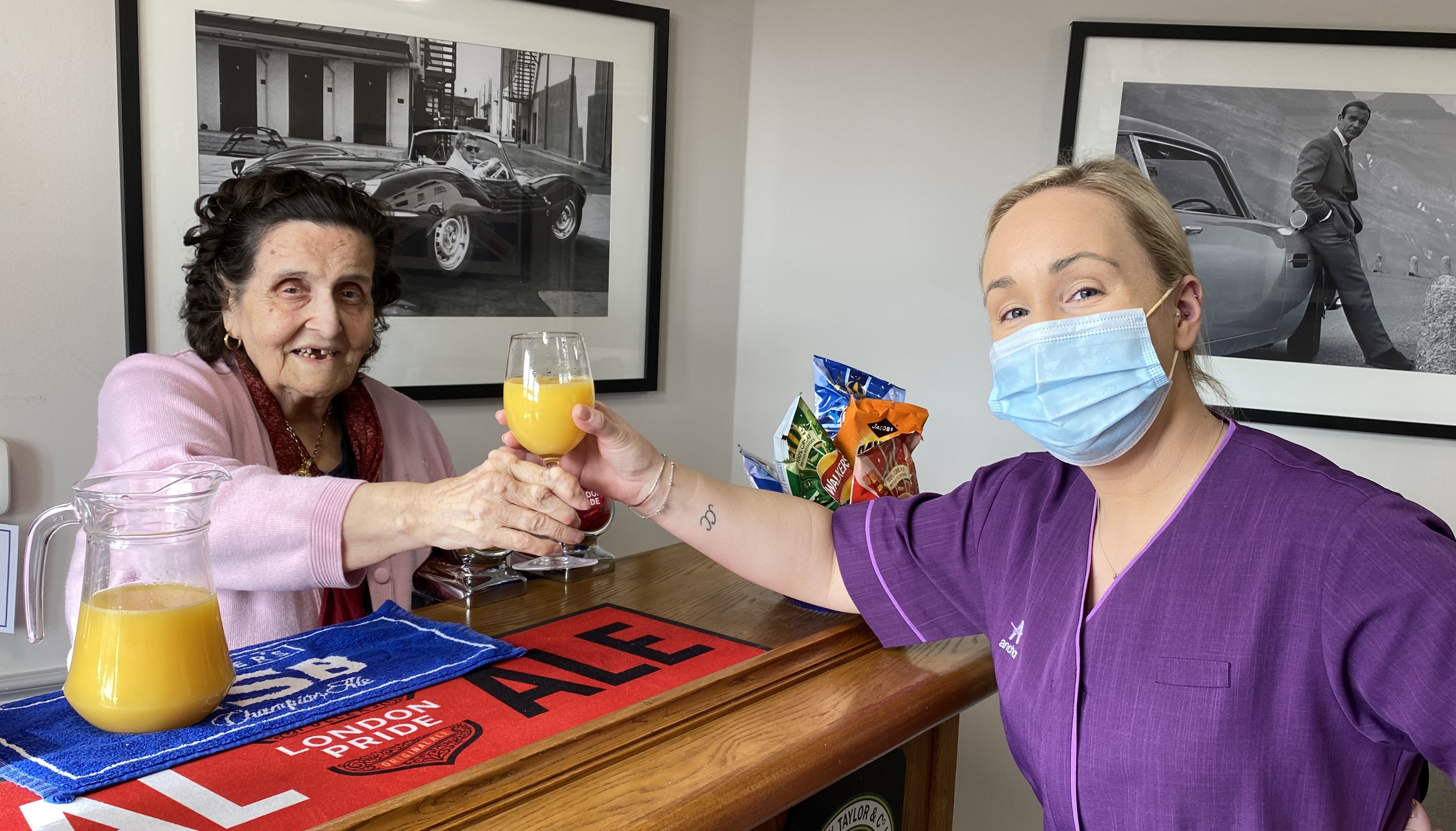 Handout photo issued by Anchor of a resident and carer (names not given) at Linwood care home in Thames Ditton which is operated by Anchor.