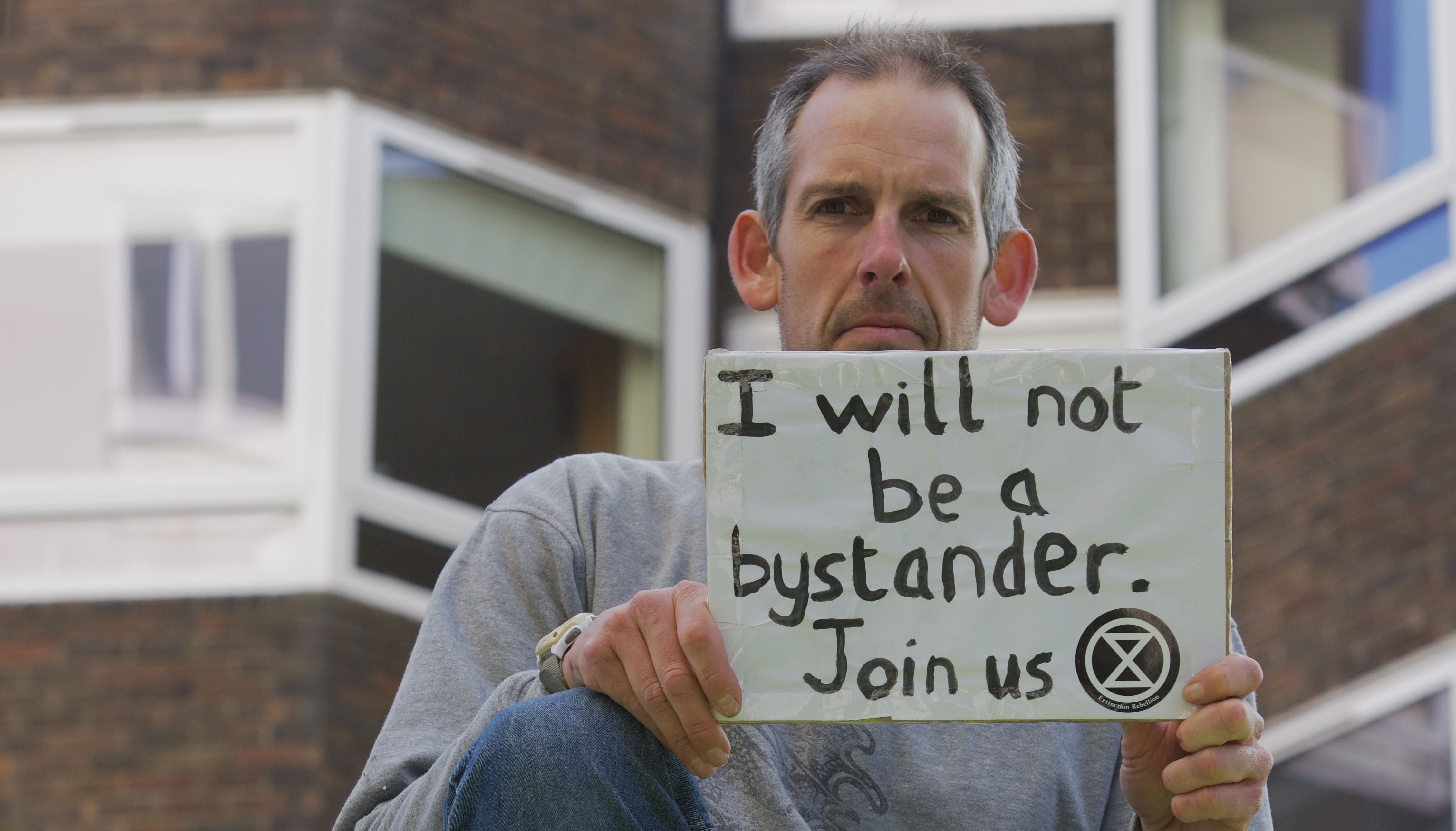 Handout photo issued by Extinction Rebellion of demonstrators taking part in protest with an oil tanker in Bayswater Road, London.