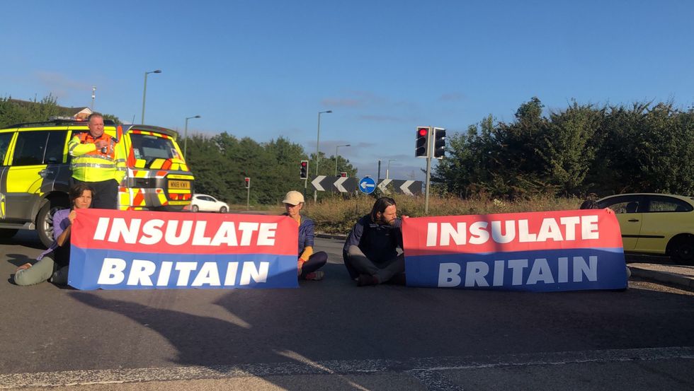 Handout photo issued by Insulate Britain of protesters taking part in blocking the M25 motorway in London. Issue date: Wednesday September 15, 2021.