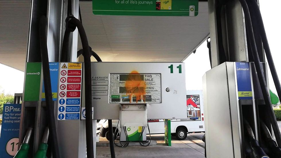 Handout photo issued by Just Stop Oil of campaigners staging a protest in the BP petrol garage at the Clacket Lane services on the M25 in Westerham, Kent. Picture date: Thursday April 28, 2022.