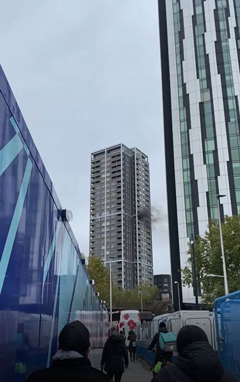 Handout photo of smoke billowing from a fire on the 18th floor of a block of flats in Elephant and Castle, south London. Picture date: Thursday November 4, 2021.
