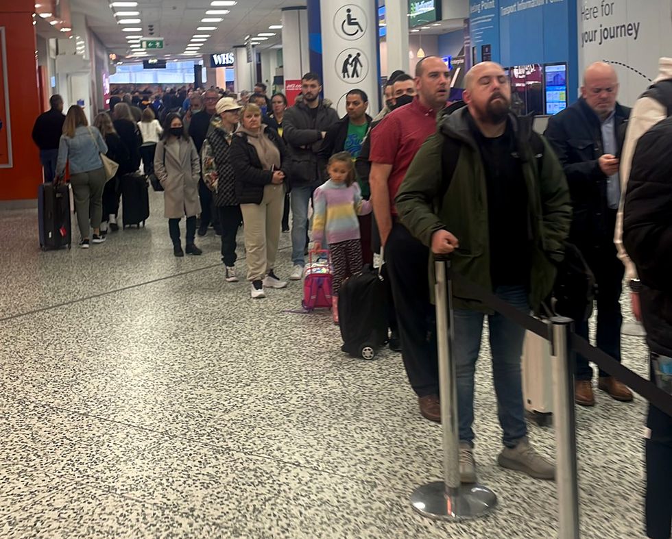 Handout photo of the security queue at Birmingham airport. Travellers embarking on overseas trips on Monday faced chaos as flights were cancelled and cross-Channel rail services were hit by major delays. Airlines are suffering from staff shortages related to coronavirus sickness, leading to flights being grounded. Picture date: Monday April 4, 2022.