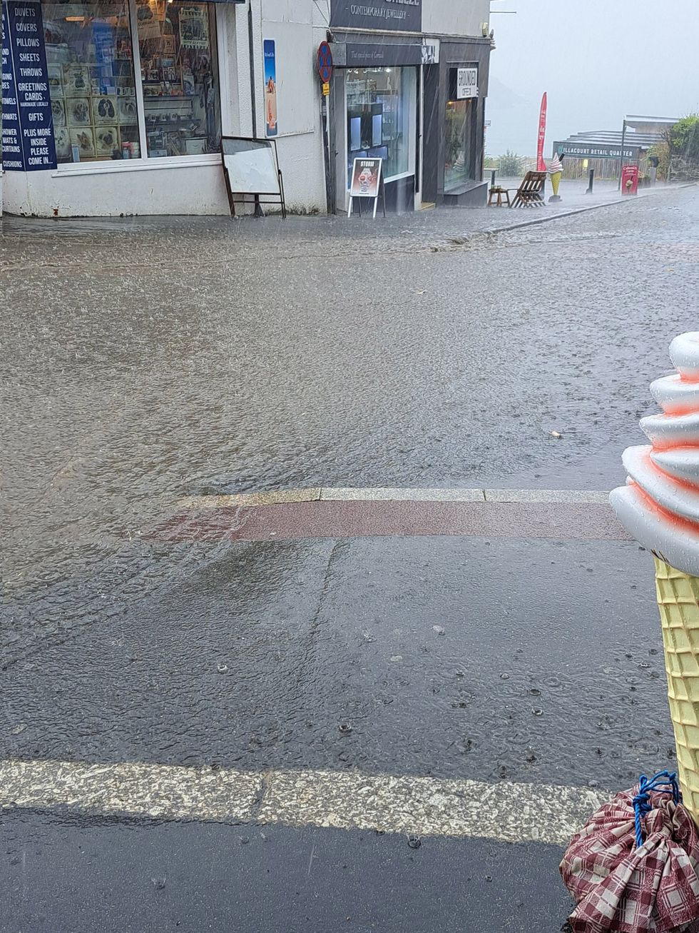 Handout photo taken with permission from the Twitter feed of @opheliaspromise of flooding on Marcus Hill in Newquay. Yellow weather warnings are in place for most of the UK on Tuesday after weeks of little rain and warm conditions have caused droughts, leaving land parched. Issue date: Tuesday August 16, 2022.