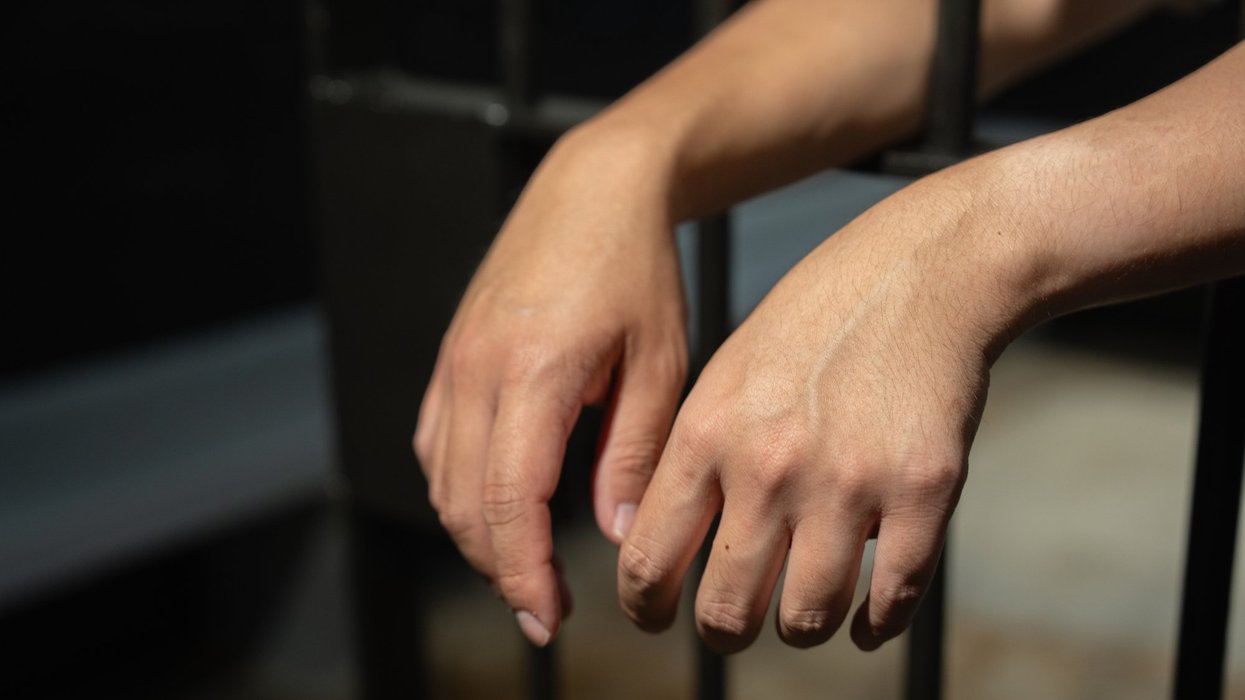 hands behind bars