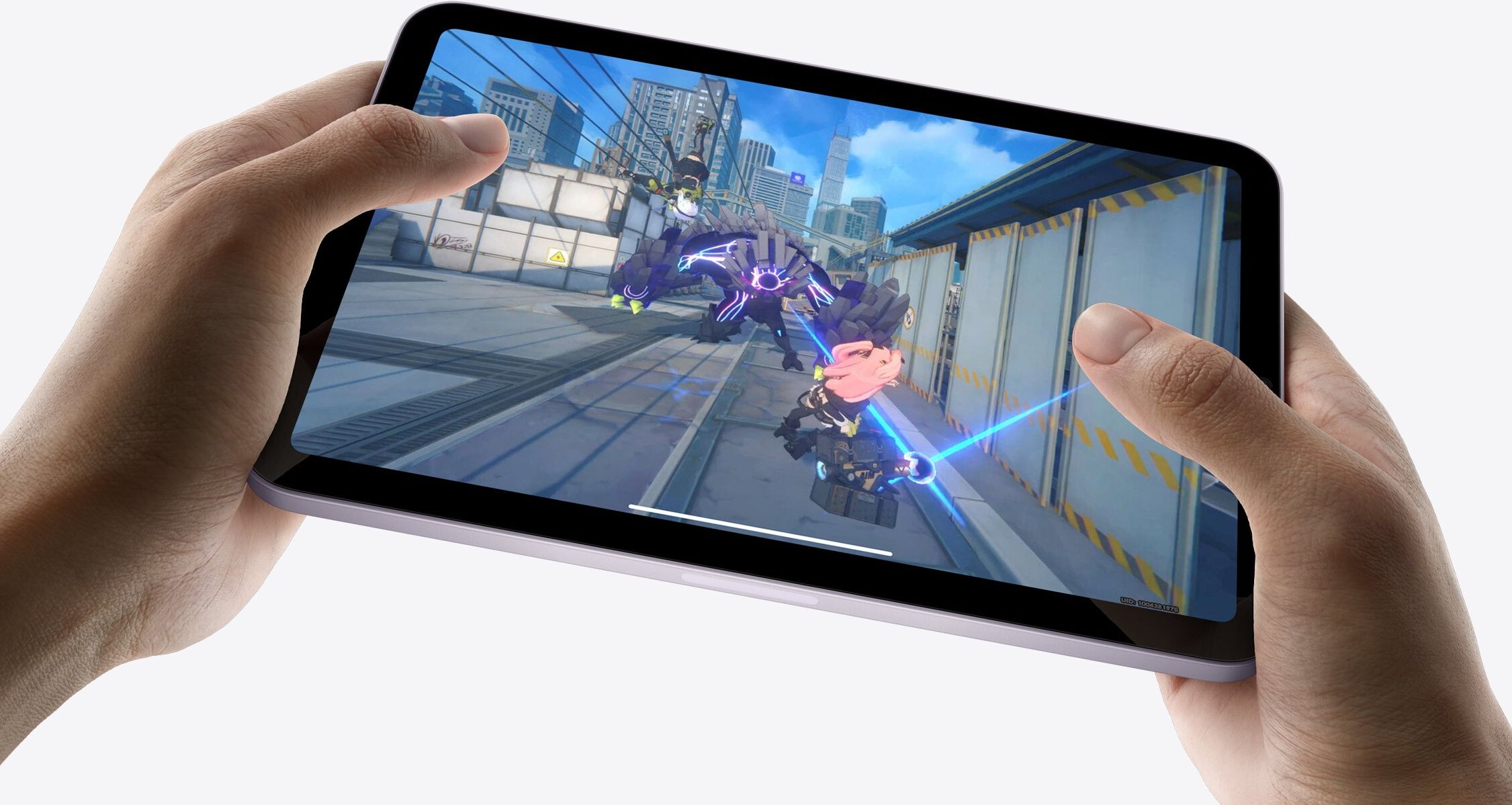 hands holding an ipad mini with a game on-screen